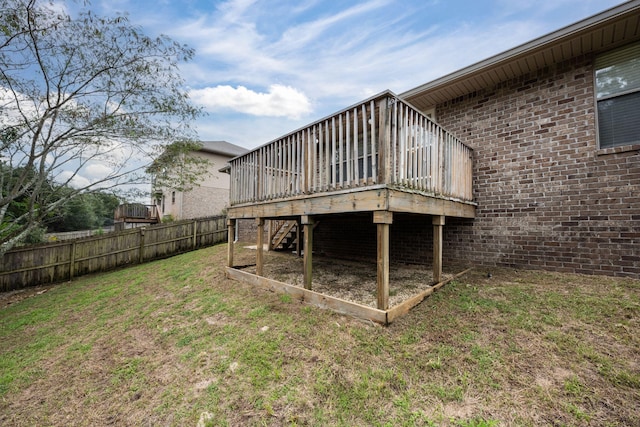 2826 Shoni Dr, Navarre, FL 32566 - back of property with fence, a yard, a deck, and brick siding