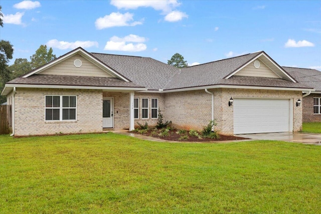 ranch-style house featuring a front lawn and a garage