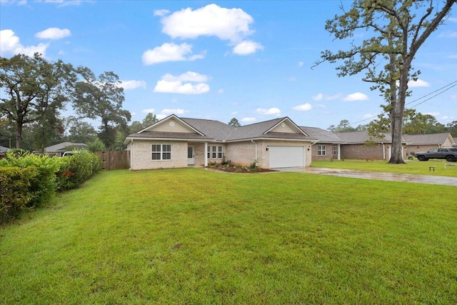 ranch-style house featuring a garage and a front lawn