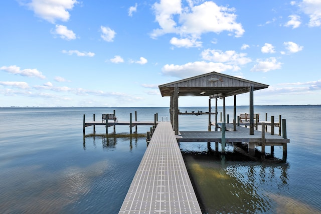 view of dock featuring a water view and boat lift