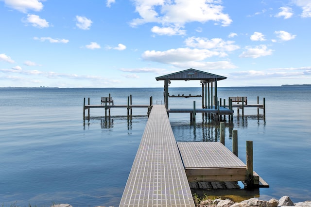 dock area with a water view and boat lift