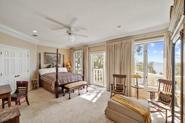 bedroom featuring ornamental molding, access to outside, light carpet, and a textured ceiling