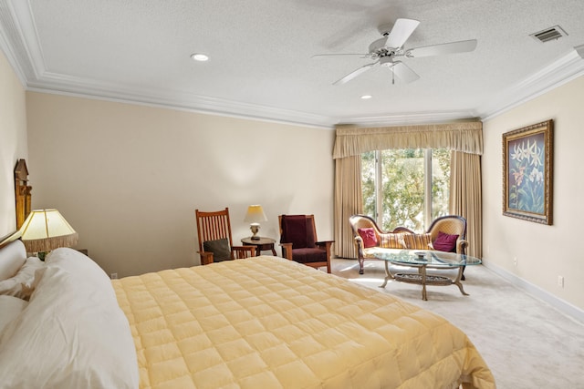 bedroom featuring carpet floors, visible vents, ornamental molding, and a textured ceiling