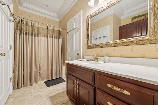 full bath featuring crown molding, vanity, and wallpapered walls