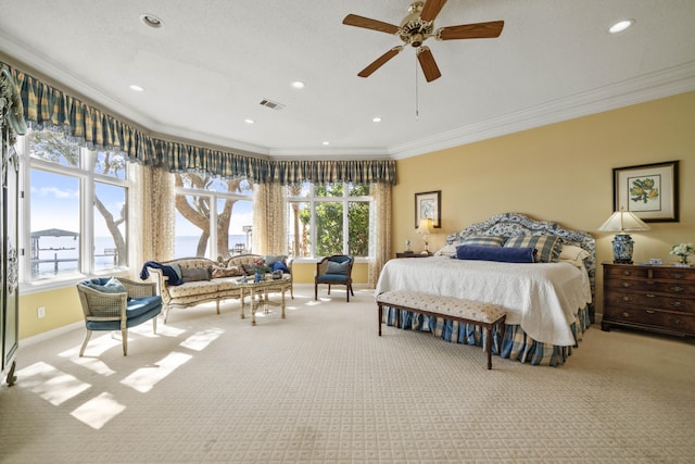 carpeted bedroom featuring crown molding, recessed lighting, visible vents, a ceiling fan, and baseboards