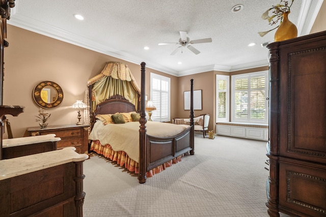 bedroom featuring a ceiling fan, light colored carpet, ornamental molding, a textured ceiling, and recessed lighting