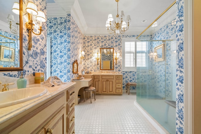 bathroom with crown molding, wallpapered walls, a sink, and a notable chandelier