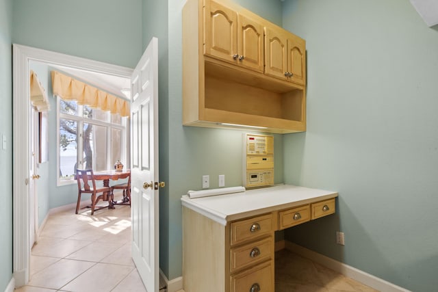 bathroom with tile patterned flooring and baseboards