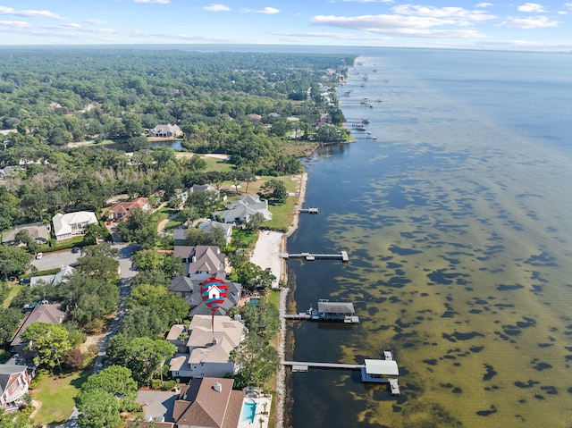 birds eye view of property featuring a water view and a residential view