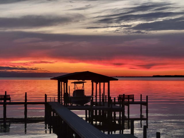 dock area featuring a water view and boat lift