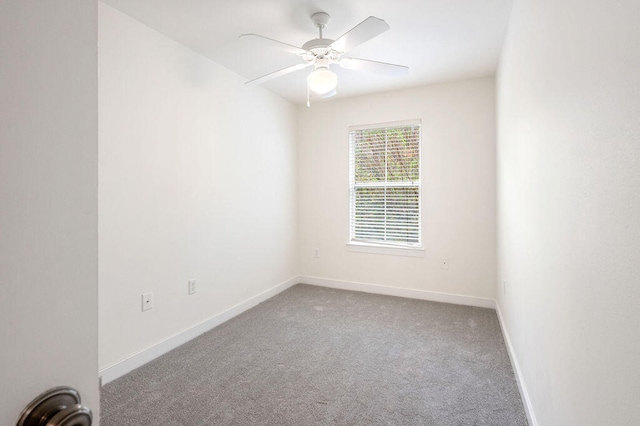 carpeted empty room with ceiling fan