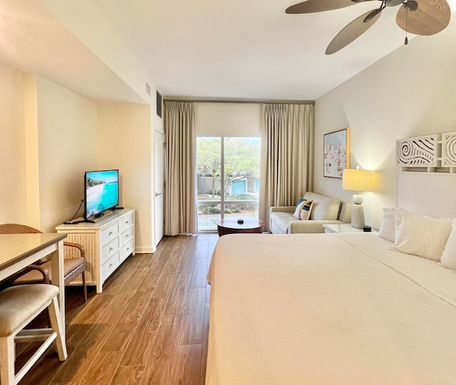 bedroom featuring access to outside, ceiling fan, and hardwood / wood-style flooring