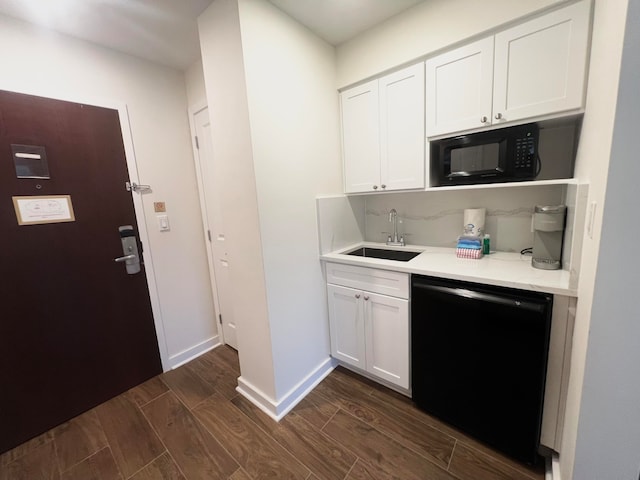 kitchen featuring black appliances, white cabinetry, sink, and dark hardwood / wood-style flooring