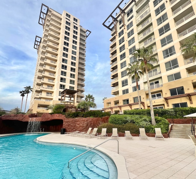 view of pool with pool water feature