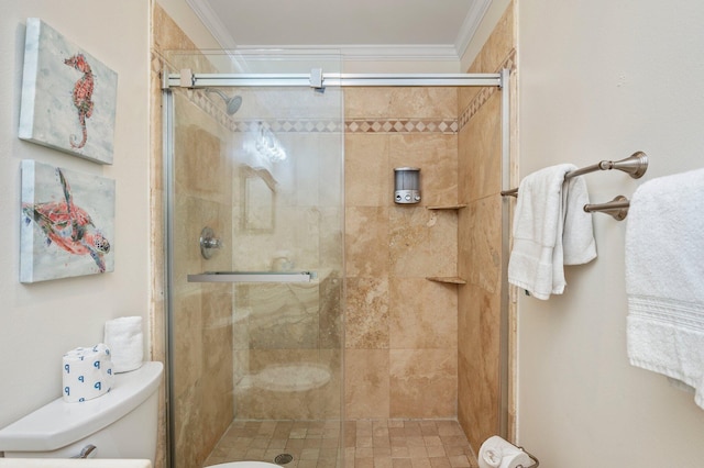 bathroom with toilet, crown molding, and walk in shower