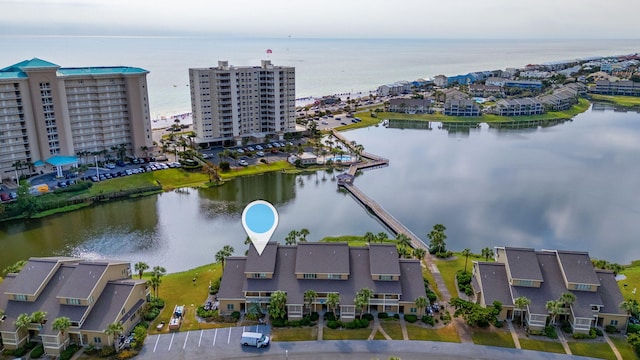 birds eye view of property with a water view