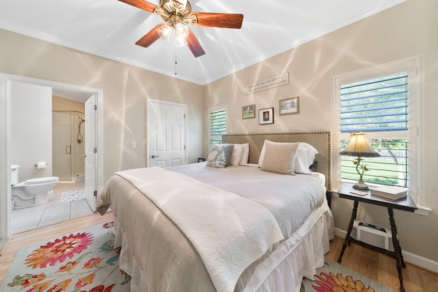 bedroom with ceiling fan, ornamental molding, ensuite bath, and light hardwood / wood-style floors