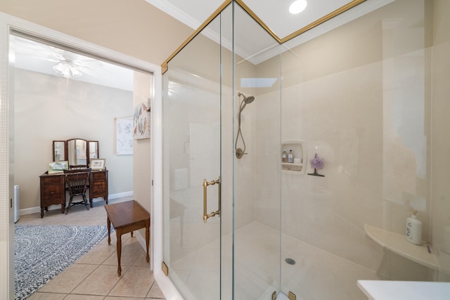 bathroom with a shower with shower door, ornamental molding, and tile patterned floors