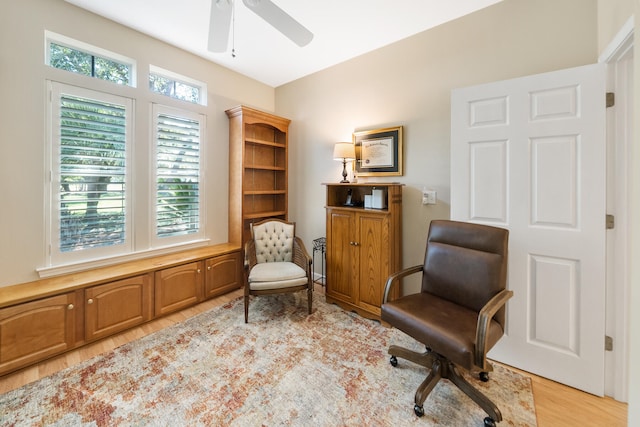 sitting room with light hardwood / wood-style flooring and ceiling fan