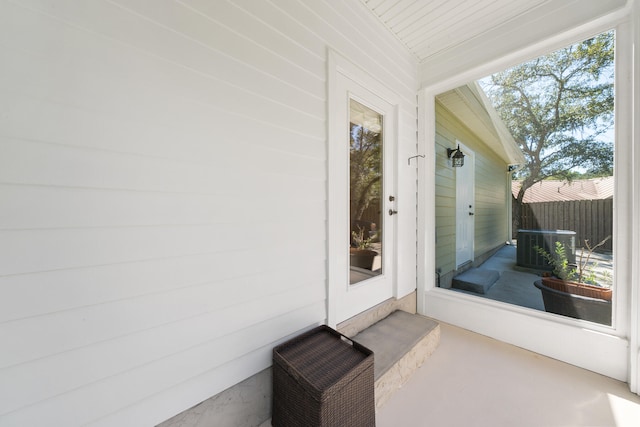 doorway to property featuring central AC unit