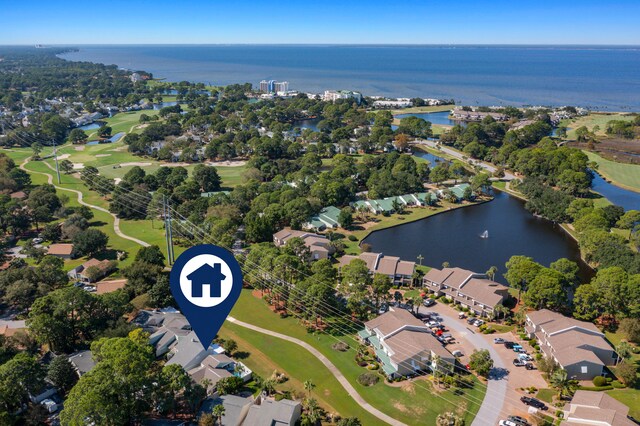 birds eye view of property with a water view