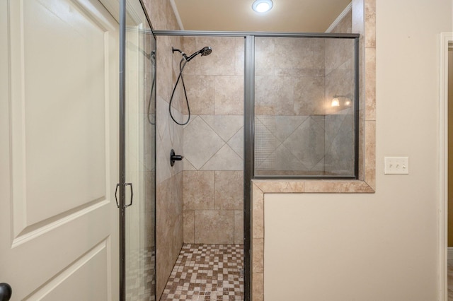 bathroom with a shower with door