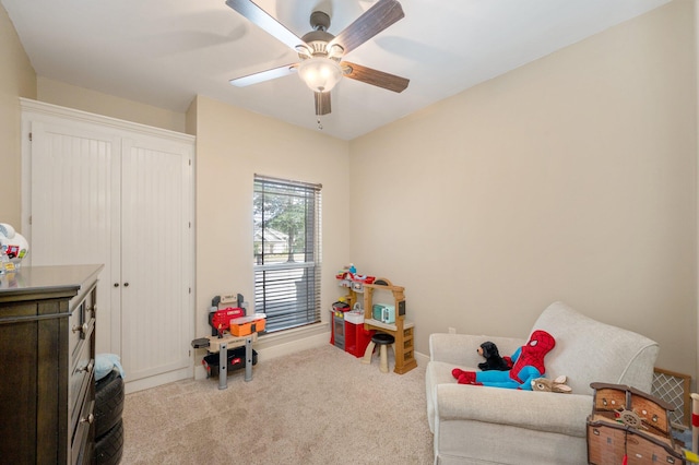 rec room featuring ceiling fan and light carpet