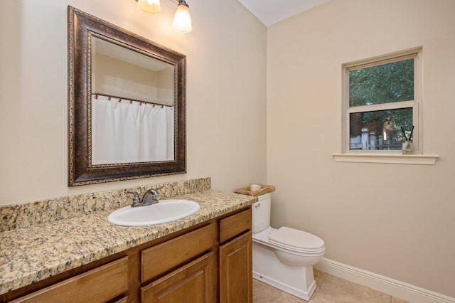 bathroom featuring vanity, toilet, and tile patterned floors