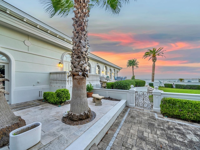 view of patio terrace at dusk