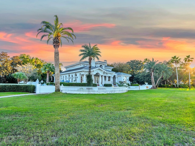 view of front of home with a yard