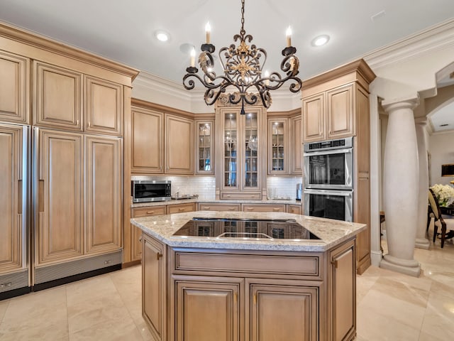 kitchen featuring backsplash, decorative columns, light stone counters, stainless steel appliances, and an island with sink