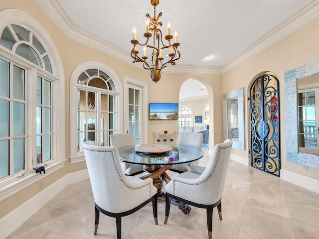 dining room with crown molding and a notable chandelier