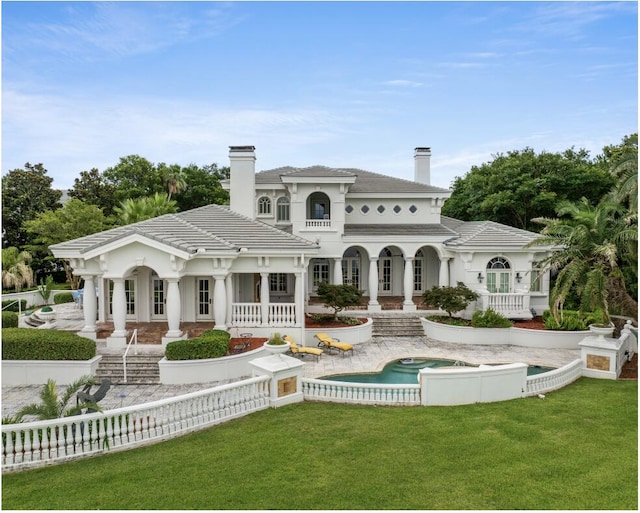 back of house featuring a yard