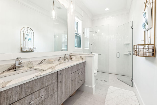 bathroom featuring a shower with door, tile patterned floors, toilet, crown molding, and vanity