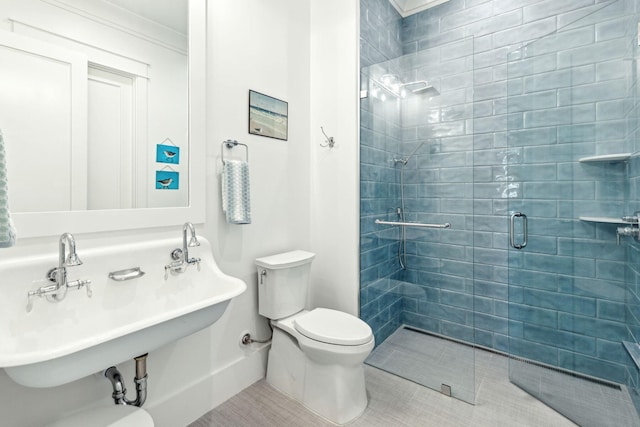 bathroom with toilet, walk in shower, ornamental molding, and tile patterned flooring