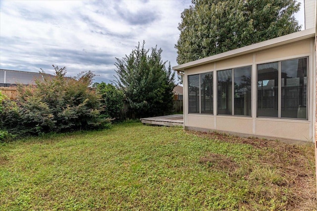 view of yard featuring a sunroom