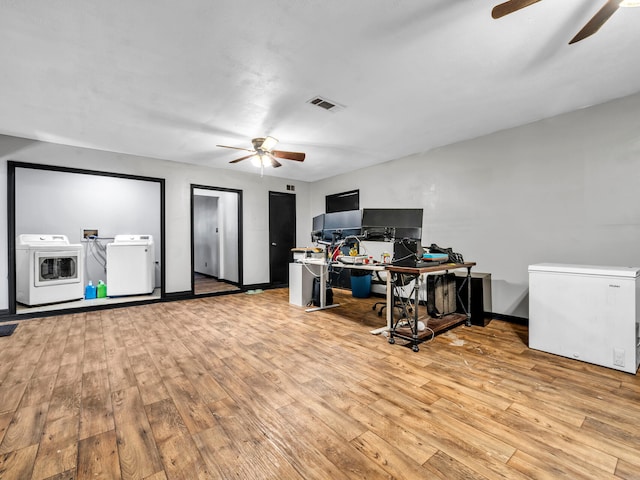 office area featuring ceiling fan, light hardwood / wood-style flooring, and washer and dryer