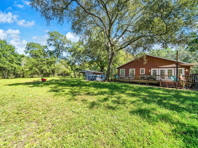 view of yard featuring a wooden deck