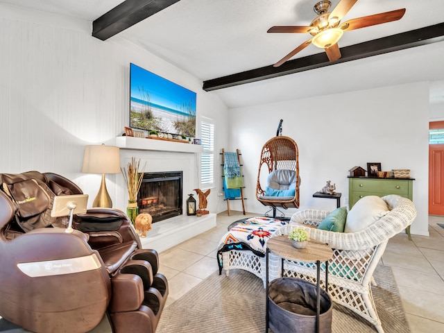 living room featuring lofted ceiling with beams, ceiling fan, wood walls, and light tile patterned floors