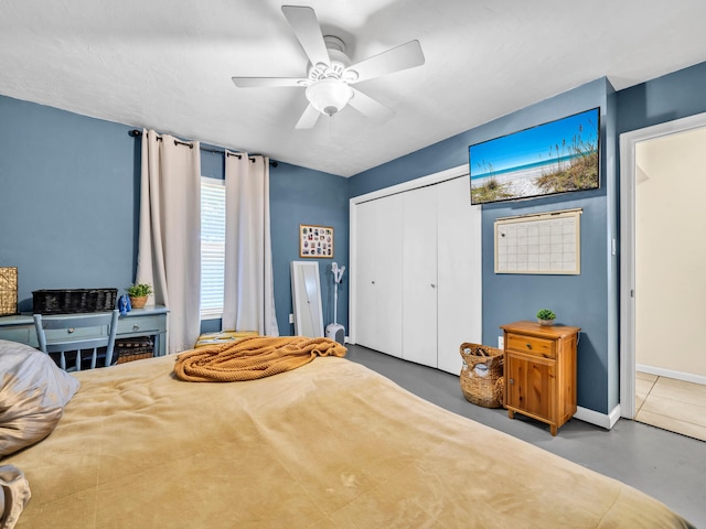 bedroom featuring ceiling fan and a closet