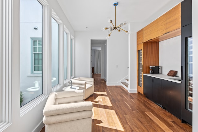 interior space featuring a notable chandelier and dark hardwood / wood-style flooring