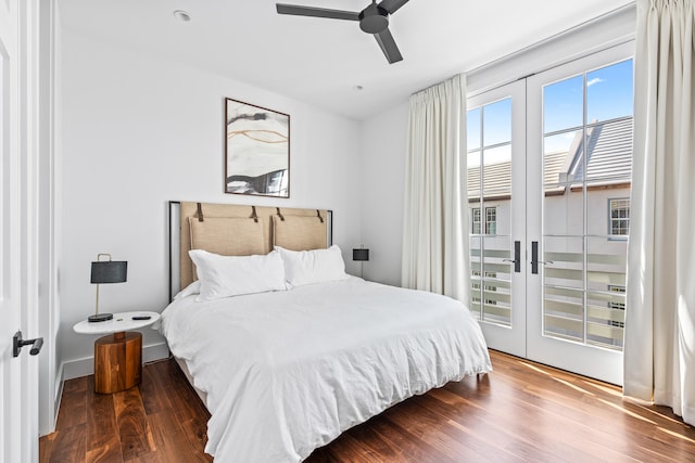 bedroom featuring ceiling fan, french doors, dark wood-type flooring, and access to outside