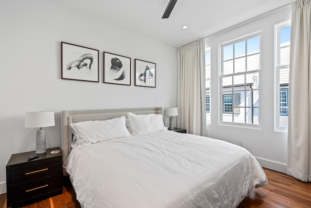 bedroom featuring dark hardwood / wood-style flooring and ceiling fan