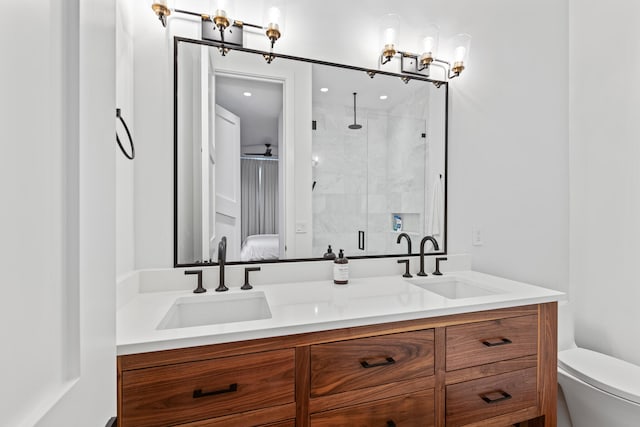 bathroom with vanity, toilet, and an enclosed shower