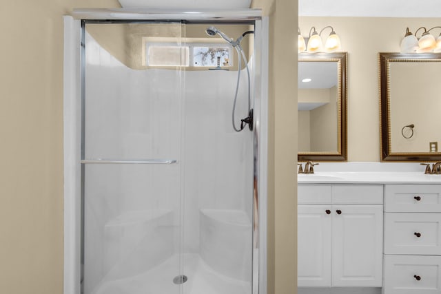 bathroom with vanity and an enclosed shower