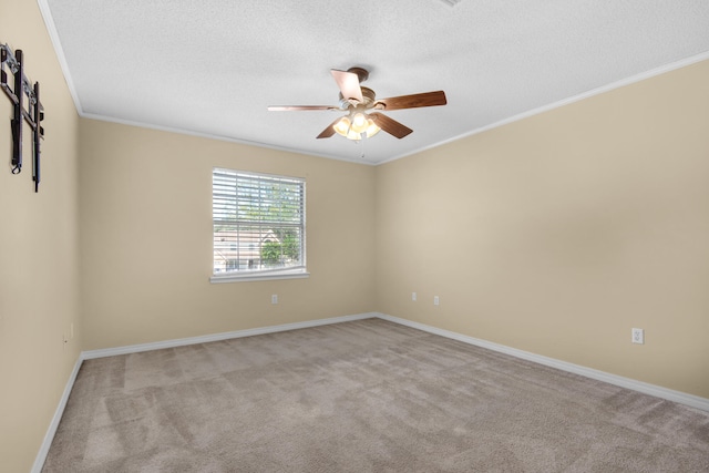 empty room with ornamental molding, light colored carpet, and ceiling fan