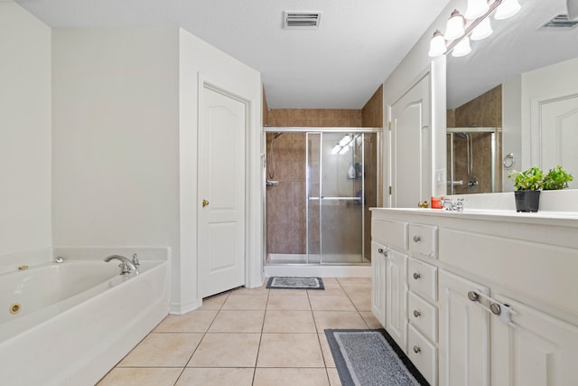 bathroom featuring vanity, shower with separate bathtub, tile patterned flooring, and a textured ceiling