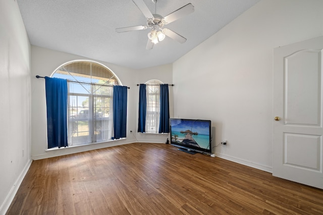 unfurnished living room with wood-type flooring, a textured ceiling, and ceiling fan