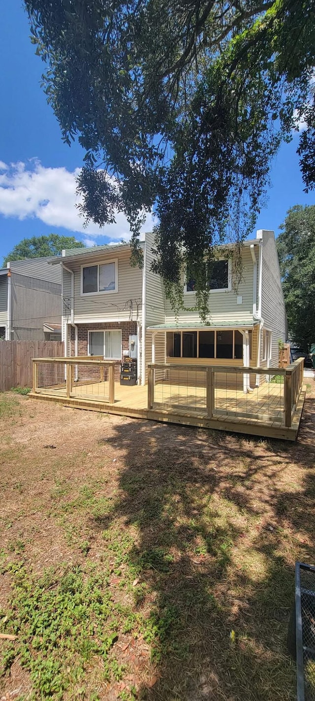 rear view of property with a wooden deck