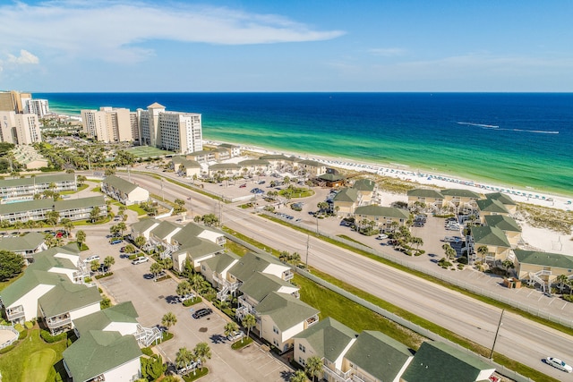 bird's eye view featuring a water view and a view of the beach